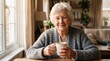 © Eduardo - Commercial lifestyle portrait of an elderly senior woman with short white hair wrapped in a patterned shawl, stirring hot tea with a spoon next to a window – senior care, cozy home environment, retire