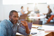 © peopleimages.com - Thinking, professional and businessman in office with ideas, reflection and planning for career. Job opportunity, remember and creative editor with problem solving for article project in workplace.