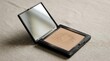 © LangkahKaki - Open compact face powder with an integrated mirror, showcasing a light beige shade, perfect for cosmetic touch-ups and achieving a smooth, flawless skin complexion