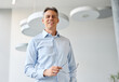 © Lumos sp - Portrait of an middle aged businessman during a meeting in the office