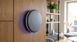 © Firman Dasmir - Modern smart home device seamlessly integrated into elegant wooden interior design with ambient