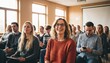 © hasan - Diverse group of people attending a presentation or lecture in a modern conference room.