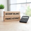 © BIBI - Account balance and finance accuracy concept with wooden blocks and calculator on a light wooden surface