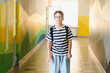 © Serhii - Schoolboy walking in school corridor during break time