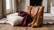 © DSGNCO - Brown leather handbag and boots on wooden floor.