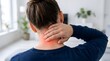 © Tarlim - Young woman suffering from chronic neck pain and cervical tension holding her hand on sore muscle area at home