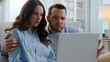 © Yuliia - Caucasian discussing searching shopping purchases planning relocation apartment renovation man woman wife husband buying search in internet at home family discuss combined budget e-commerce