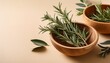 © Terry - fresh rosemary sprigs in natural bowls with eucalyptus leaves on a beige background