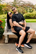 © Stas Pylypets/Stocksy - A young couple out for a walk in the park