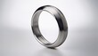 © Thomas - metallic silver ring hovering over a white background creating a sleek and modern aesthetic ideal for various design projects