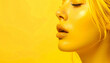 © Bediha Duru Öksüz - Artistic monochrome portrait of a woman with yellow face paint and hair. Artistic side profile portrait of a young woman painted entirely in vibrant yellow tone. Creative avant-garde beauty photograph