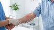 © Creatify_Tech - Doctor checking skin rash on male patient’s arm, examining symptoms of allergic reaction.