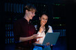 © Zoran Jesic - It professionals analyzing data on laptop in server room