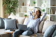 © PheelingsMedia - Proud and satisfied teleworker resting and relaxing at home