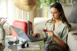 © PheelingsMedia - Tourist booking online holding card on vacation