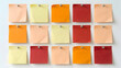 © Umme - A carefully arranged overhead view of vibrant colorful gift tags presented on a pristine white surface ideal for holiday celebrations and gift giving