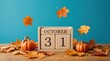 © MASUD - Wooden calendar block showing october 31 with pumpkins and falling autumn leaves on a blue background