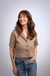 © sepy - Studio portrait of an attractive brunette haired woman standing against isolated background, copy space