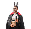 © Pixel-Shot - Young man dressed as vampire for Halloween with horns, spell book and candle isolated on white background