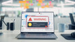 © Gorodenkoff - Laptop on Desk Displaying a Critical Virus Alert Warning Pop-up Over Financial Charts, Signaling a Compromised System in Open Plan Office Interior.