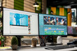 © DC Studio - Empty dual-monitor workstation displays video editing and streaming software for motion-picture retouching, audio synchronization and sound effects during filmmaking in a creative agency office.
