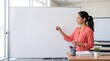 © Aurora Aesthetics - teacher classroom whiteboard school education lesson woman teaching planning students writes on a clean board for instruction preparation professional learning and educator recruitment campaigns