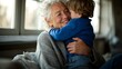 © Evarelle - Elderly grandmother hugging young grandson indoors. Senior woman and child sharing affectionate embrace. Family bond and multi-generational love concept