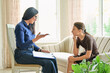 © Valerii Honcharuk - Child psychologist consulting a schoolgirl in office mental health therapy session
