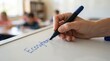 © SimpleDesignStudio - Teacher writing Ecosystems on a whiteboard in front of elementary school students in a bright classroom