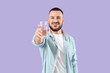 © Pixel-Shot - Young man with glass of water on lilac background