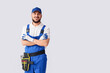 © Pixel-Shot - Male worker smiling on white background