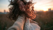 © BlackBridge Media - Happy Young Woman Spinning Outdoors During Golden Hour Sunset