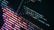 © Yurgentum - Close-up of source code displaying functions and variables with colorful syntax highlighting on a dark screen.