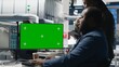 © DC Studio - Diverse solar power team reviews data on a computer beside a green screen, identifying manufacturing errors and optimizing clean energy and photovoltaic operations with copy space for compositing.
