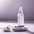 © Bowenn - Cosmetic spray bottle with lavender flower and smooth spa stones for wellness