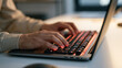 © forenna - Close up on a coding bootcamp instructor's hands typing rapidly on a mechanical keyboard inside a minimalist studio, the sharp detail of callused fingertips striking backlit keys