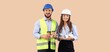 © Pixel-Shot - Smiling male and female engineers in hard hats and safety vests holding coffee and blueprints, the man holds a tray with two takeaway coffee cups, and the woman holds rolled blueprints