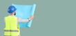 © Pixel-Shot - Construction worker in a blue hard hat and safety vest holding a rolled-up blueprint, back view, isolated on a solid background