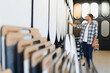 © Serhii - Man choosing wall finish samples in decor studio