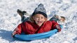 © Lubos Chlubny - Child having fun sledding down snowy hill