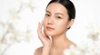 © Masque - Elegant portrait of a stunning young Asian woman with clear skin on a white backdrop.