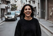 © Pixel-Shot - Happy young woman with dark hair laughing joyfully while walking on a city street with cars in the background, Her genuine smile and carefree expression convey happiness and positive emotions