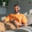 © Andrii Zastrozhnov - Relaxed young man on a couch using a smartphone for app promotion background and lifestyle banner design