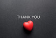 © Radha - Heartfelt thank you message with a small red heart shape on dark background perfect for gratitude cards