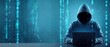 © Mustafa Kawa - Hacker in a hoodie working on a laptop with digital binary code rain on a blue background