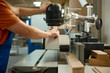 © Nomad_Soul - Skilled technician precisely guides cutting tool to produce detailed and flawless wood contours