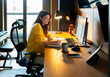 © Artcore Studio/Stocksy - Woman Working at Computer
