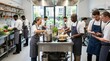 © Iswanto - Professional chefs preparing food in commercial restaurant kitchen.