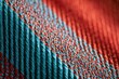 © Diana - Abstract macro of woven fabric with interlaced teal and crimson threads