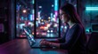 © SunSpirit - Young woman types on laptop in neon light with a blurred night city background.